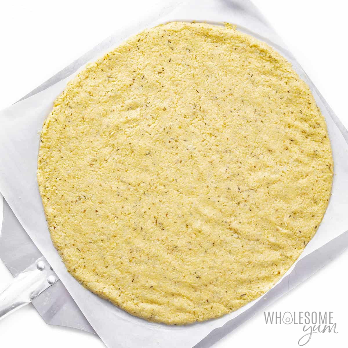 Cauliflower pizza crust before baking.