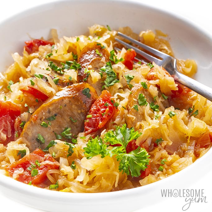 Slow cooker kielbasa and sauerkraut in a white bowl