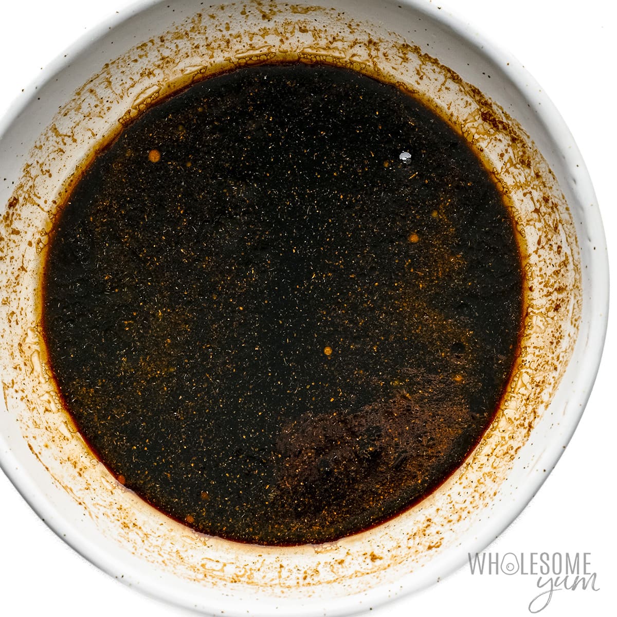 Teriyaki sauce ingredients whisked together in a bowl.